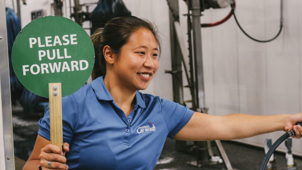 Hoffman Car Wash Employee with Pull Forward Sign