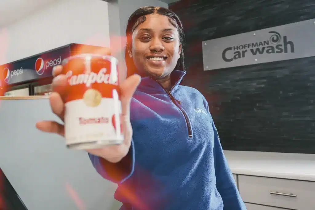 Photo of a woman holding a soup can