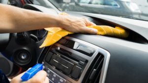 Hoffman Car Wash Team Member wiping dashboard with towel