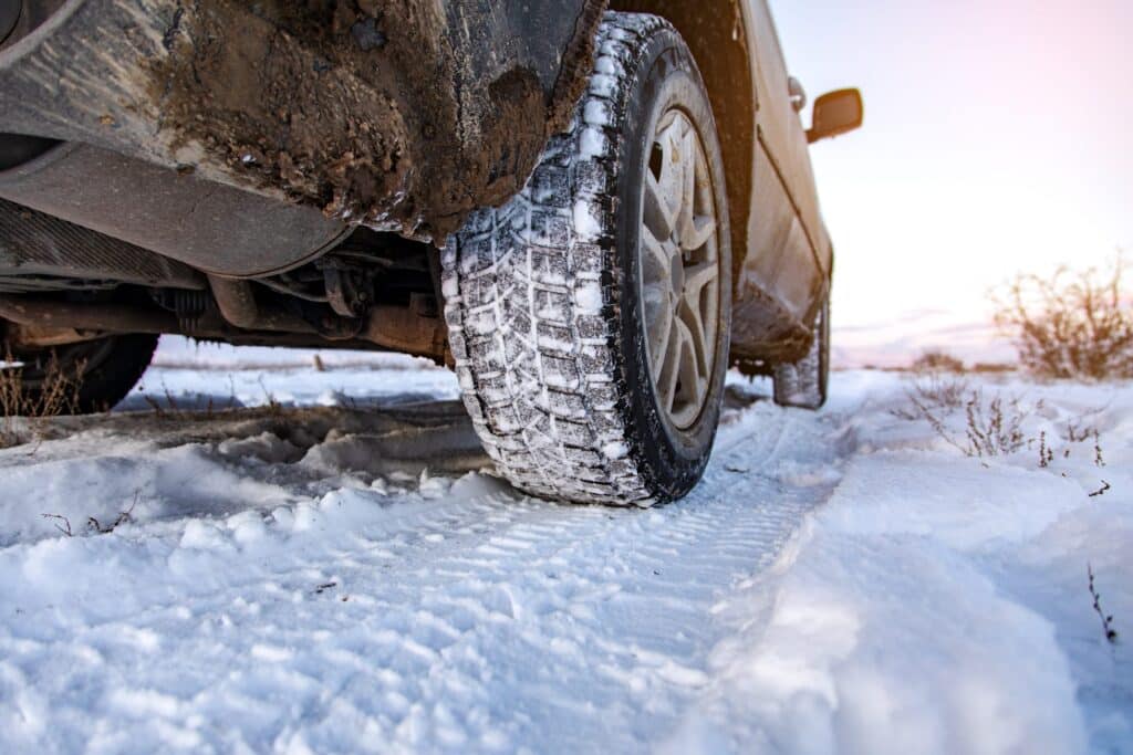Car tires on winter road