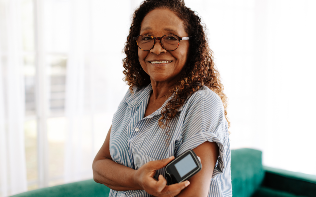 Woman with a glucose monitor on their arm