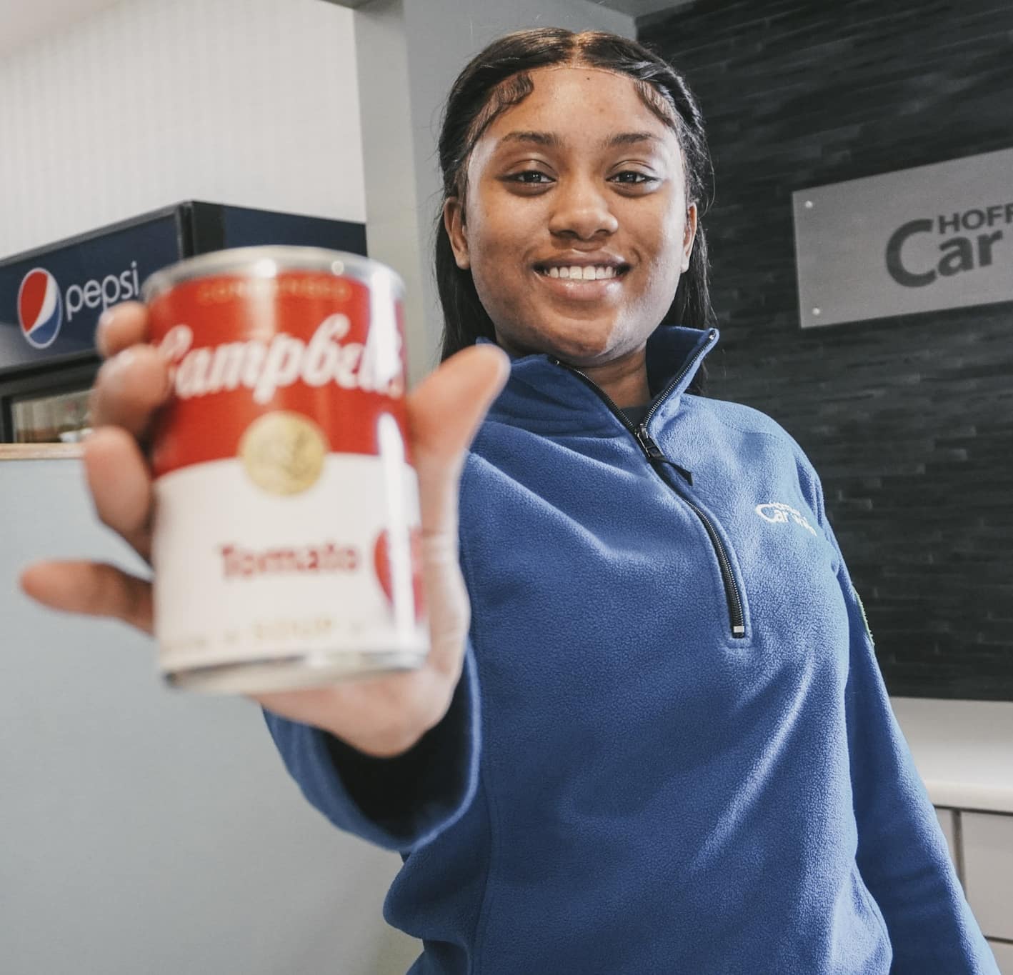 Woman holding a can of tomato soup